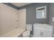 Updated bathroom with white vanity and bathtub at 801 N Mebane St, Burlington, NC 27217