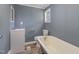 Bathroom with clawfoot tub and white vanity at 801 N Mebane St, Burlington, NC 27217
