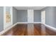 Spacious bedroom with hardwood floors and neutral walls at 801 N Mebane St, Burlington, NC 27217