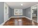 Dining room with hardwood floors and access to the kitchen at 801 N Mebane St, Burlington, NC 27217