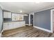 White kitchen cabinets, granite countertops and stainless steel sink at 801 N Mebane St, Burlington, NC 27217