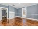 Living room with hardwood floors, fireplace, and blue walls at 801 N Mebane St, Burlington, NC 27217