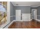 Living room with hardwood floors, fireplace, and built-ins at 801 N Mebane St, Burlington, NC 27217