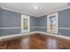 Spacious living room featuring hardwood floors and wainscoting at 801 N Mebane St, Burlington, NC 27217