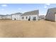 Spacious backyard with patio and partial view of neighboring homes at 803 Golden Plum Ln, Zebulon, NC 27597