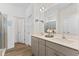 Elegant bathroom boasts double vanity, large mirror, and a walk-in shower at 803 Golden Plum Ln, Zebulon, NC 27597