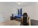 Bedroom with gaming chair and window at 803 Golden Plum Ln, Zebulon, NC 27597
