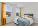 Spacious bedroom with two large windows and neutral decor at 803 Golden Plum Ln, Zebulon, NC 27597