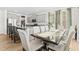 Bright dining room with a wood table and six upholstered chairs at 803 Golden Plum Ln, Zebulon, NC 27597