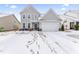 Two-story home with gray siding and two-car garage at 803 Golden Plum Ln, Zebulon, NC 27597