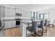 Modern kitchen featuring gray cabinets, granite counters, and stainless steel appliances at 803 Golden Plum Ln, Zebulon, NC 27597
