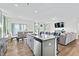 Spacious kitchen with large island, granite countertops and open living area at 803 Golden Plum Ln, Zebulon, NC 27597