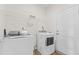 Laundry room with washer, dryer, and ample shelving at 803 Golden Plum Ln, Zebulon, NC 27597