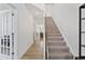 Carpeted staircase leading to the upper level of the home at 803 Golden Plum Ln, Zebulon, NC 27597