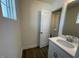 Bathroom with a white door, vanity and sink at 85 N Stagecoach Dr, Wendell, NC 27591