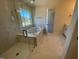 Bathroom featuring a glass shower, tub, and a view of the neighborhood at 85 N Stagecoach Dr, Wendell, NC 27591