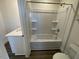 Bright bathroom featuring a shower over the tub, and white vanity at 85 N Stagecoach Dr, Wendell, NC 27591