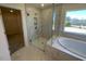 Bathroom with a glass shower and bathtub at 85 N Stagecoach Dr, Wendell, NC 27591