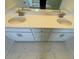 Bathroom boasts a double vanity with modern fixtures and stylish white cabinets at 85 N Stagecoach Dr, Wendell, NC 27591