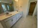 Elegant bathroom featuring a double sink vanity with modern fixtures and a mirror at 85 N Stagecoach Dr, Wendell, NC 27591