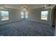 Spacious bedroom with multiple windows and plush carpeting at 85 N Stagecoach Dr, Wendell, NC 27591