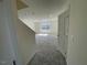 View of spacious bonus room featuring neutral carpeting and natural light from window at 85 N Stagecoach Dr, Wendell, NC 27591