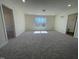 Spacious bonus room features neutral carpeting and a window for natural light at 85 N Stagecoach Dr, Wendell, NC 27591