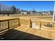 Inviting wood deck perfect for entertaining with a view of the neighborhood and blue sky at 85 N Stagecoach Dr, Wendell, NC 27591