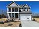 Beautiful two story home with a two-car garage, covered porch and gray siding at 85 N Stagecoach Dr, Wendell, NC 27591