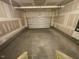 Spacious garage with high ceilings and a partially visible door at 85 N Stagecoach Dr, Wendell, NC 27591