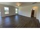 Bright and open living room space with hardwood flooring and large windows at 85 N Stagecoach Dr, Wendell, NC 27591