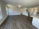 Spacious living room with modern flooring and staircase at 85 N Stagecoach Dr, Wendell, NC 27591