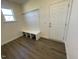 Functional mudroom with bench, hooks, and window for natural light at 85 N Stagecoach Dr, Wendell, NC 27591