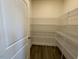 Walk-in pantry features lots of shelving for food storage at 85 N Stagecoach Dr, Wendell, NC 27591