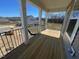 Outdoor wooden porch with black railings at 85 N Stagecoach Dr, Wendell, NC 27591