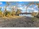 Large backyard with mature trees surrounding the home at 919 Fiske St, Durham, NC 27703