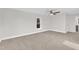 Bright bedroom with neutral carpeting and a ceiling fan at 919 Fiske St, Durham, NC 27703