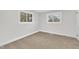 Well-lit bedroom with neutral walls and carpet flooring at 919 Fiske St, Durham, NC 27703
