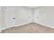 Spacious bedroom with neutral carpet and two closets at 919 Fiske St, Durham, NC 27703