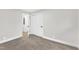 Bright bedroom with carpet, double closet, and access to hallway at 919 Fiske St, Durham, NC 27703