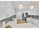 Modern kitchen with white cabinets, quartz countertops, and stylish backsplash at 919 Fiske St, Durham, NC 27703