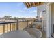 Outdoor seating on balcony overlooking residential area and tree line in the distance at 101 Ailey Brook Way # 100, Wake Forest, NC 27587