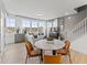 Open-concept living room with ample natural light, stylish furniture, and seamless flow to other spaces at 101 Ailey Brook Way # 100, Wake Forest, NC 27587