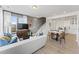 Inviting living room with a comfortable white sofa, stylish decor, and an open concept to the kitchen at 101 Ailey Brook Way # 100, Wake Forest, NC 27587