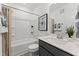Clean bathroom with a tub/shower combo, vanity, and modern fixtures and decor at 105 Ailey Brook Way # 100, Wake Forest, NC 27587