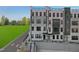 Striking townhome with multiple stories, black window frames, and a private rooftop terrace at 105 Ailey Brook Way # 100, Wake Forest, NC 27587