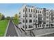 Modern townhome exterior featuring gray brick, black accents, and a rooftop terrace at 105 Ailey Brook Way # 100, Wake Forest, NC 27587