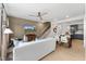 Open living space with modern decor, a white sofa, and seamless flow to the kitchen at 105 Ailey Brook Way # 100, Wake Forest, NC 27587
