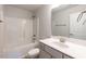 Clean bathroom with a shower-tub combo, white vanity, large mirror, and tile flooring at 107 Northwood Dr, Fuquay Varina, NC 27526