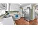 Modern kitchen features stainless steel refrigerator, oven, and plenty of cabinet space at 108 Doe Cir, Selma, NC 27576